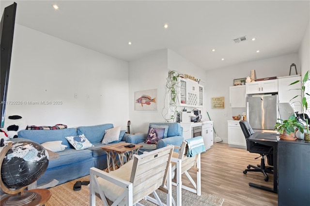 living room with light hardwood / wood-style floors