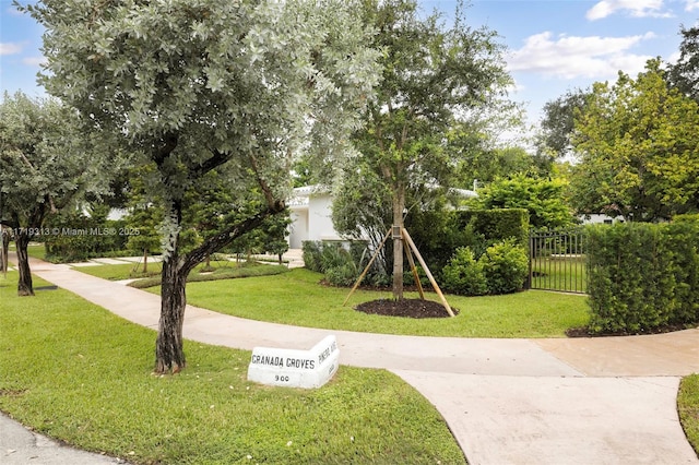 surrounding community featuring a lawn