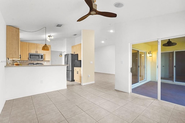 kitchen featuring ceiling fan, light brown cabinets, stainless steel appliances, kitchen peninsula, and light tile patterned floors