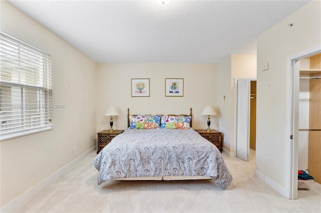 carpeted bedroom with a closet