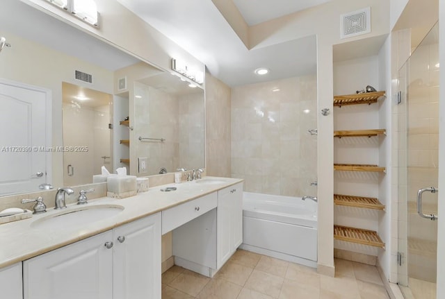 bathroom featuring tile patterned flooring, vanity, and independent shower and bath