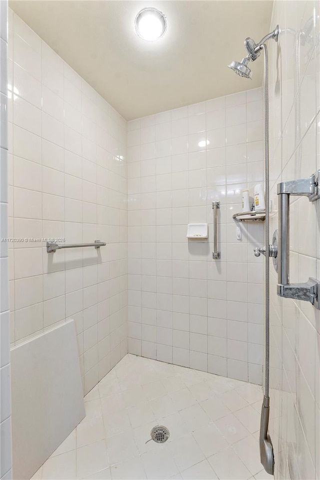 bathroom with tiled shower