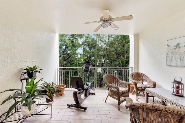 view of patio featuring ceiling fan and a balcony