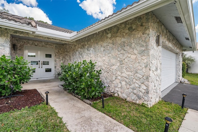 doorway to property with a garage