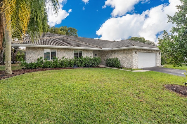 single story home with a garage and a front yard