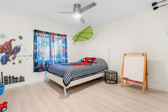 bedroom featuring ceiling fan and light hardwood / wood-style floors