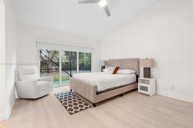 bedroom featuring ceiling fan, light hardwood / wood-style floors, access to outside, and vaulted ceiling