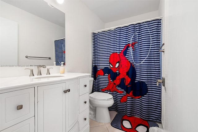 bathroom featuring tile patterned floors, vanity, and toilet