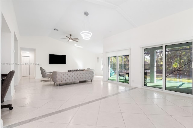 unfurnished living room featuring ceiling fan, light tile patterned flooring, and lofted ceiling