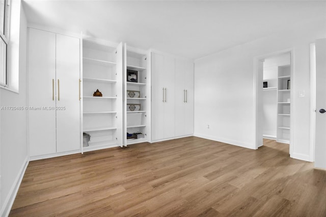 unfurnished living room with light wood-type flooring