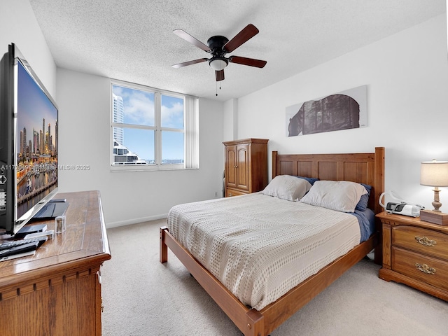 770 Claughton Island Dr Unit 1709, Miami, FL 33131 - bedroom featuring baseboards, a ceiling fan, light carpet, and a textured ceiling