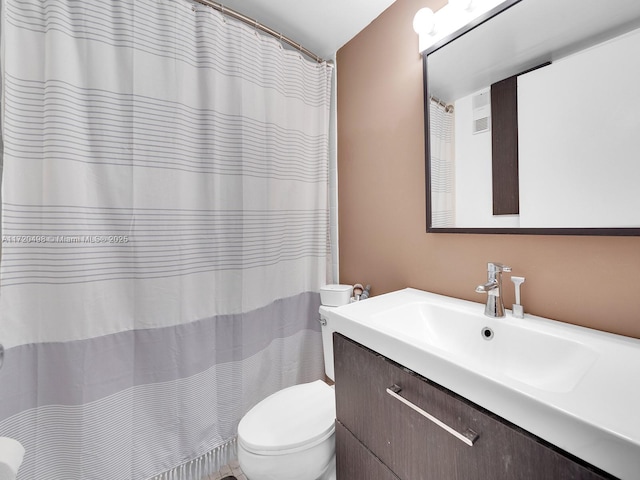 bathroom with a shower with shower curtain, vanity, and toilet