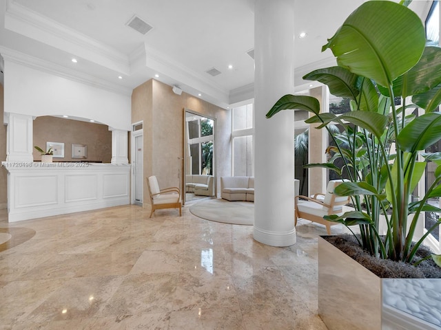 interior space with marble finish floor, decorative columns, and recessed lighting