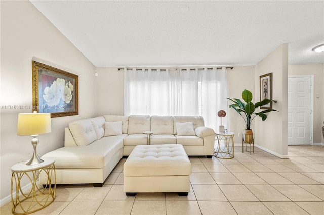 living room featuring lofted ceiling and light tile patterned flooring