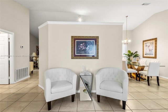 sitting room with light tile patterned floors, vaulted ceiling, a notable chandelier, and crown molding