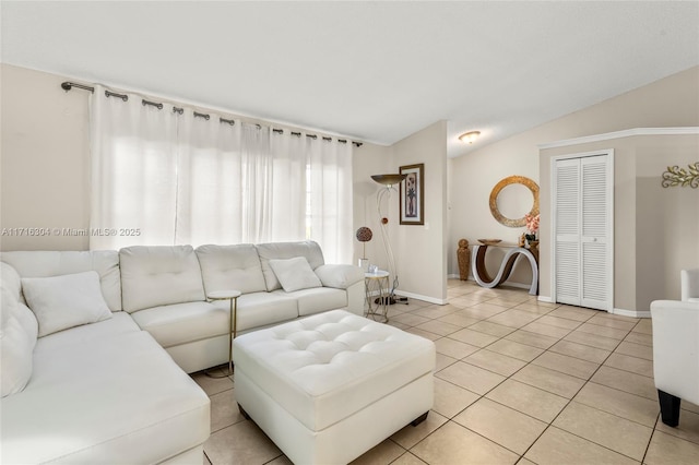 living room with light tile patterned flooring and lofted ceiling