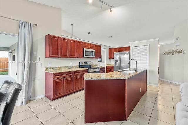 kitchen with a center island with sink, crown molding, light stone countertops, light tile patterned flooring, and stainless steel appliances