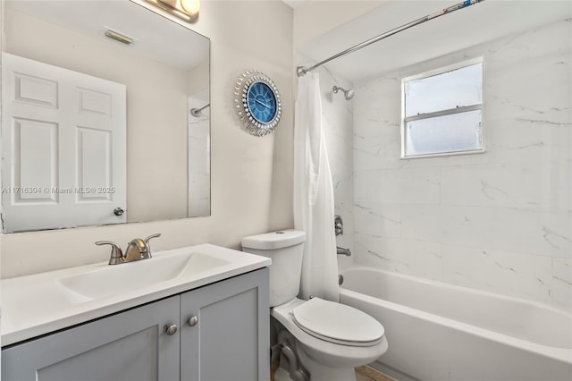 full bathroom with shower / bath combination with curtain, vanity, and toilet