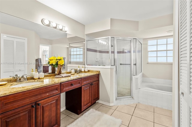 bathroom with tile patterned flooring, vanity, and independent shower and bath