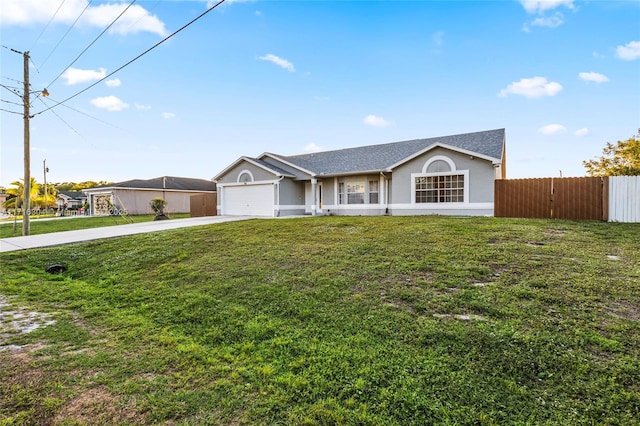 ranch-style home featuring a front yard and a garage