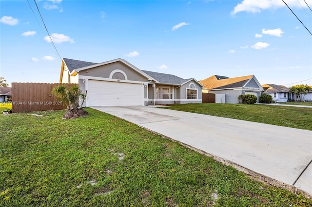 ranch-style house with a garage and a front lawn