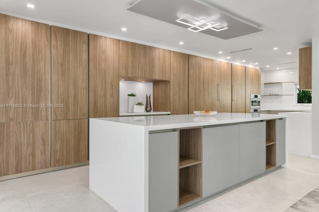 4144 Pinta Ct, Coral Gables, FL 33146 - kitchen featuring modern cabinets, a center island, open shelves, and light countertops