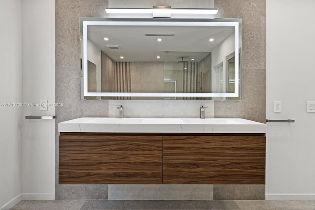 4144 Pinta Ct, Coral Gables, FL 33146 - bathroom with double vanity, visible vents, walk in shower, and a sink