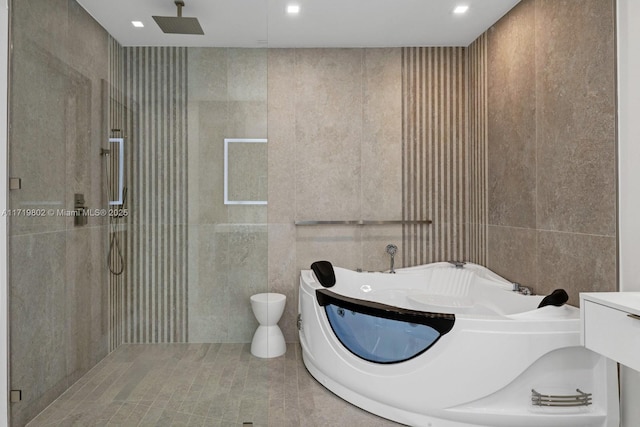 4144 Pinta Ct, Coral Gables, FL 33146 - bathroom featuring tile walls, toilet, a garden tub, and a tile shower