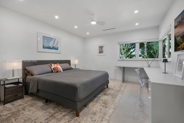 bedroom with concrete flooring, a ceiling fan, and recessed lighting