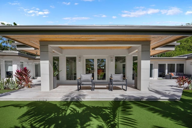 4144 Pinta Ct, Coral Gables, FL 33146 - back of house featuring a patio area and an outdoor hangout area