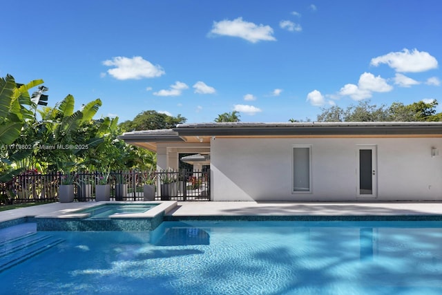 4144 Pinta Ct, Coral Gables, FL 33146 - view of swimming pool with fence, a patio area, and a pool with connected hot tub