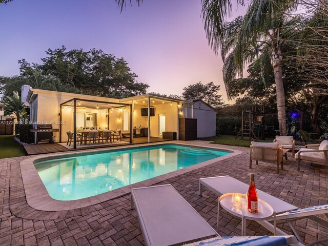 view of pool featuring a patio and an outdoor hangout area