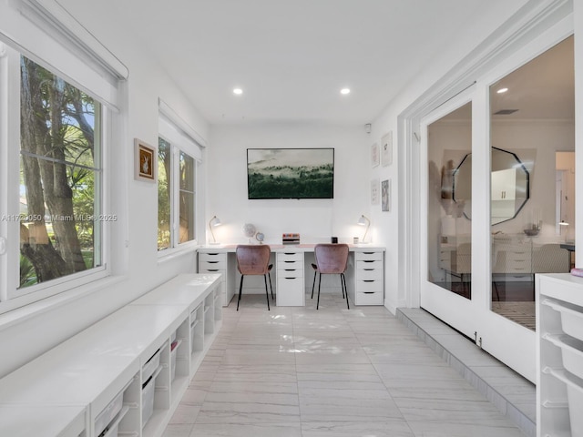 home office featuring built in desk and recessed lighting