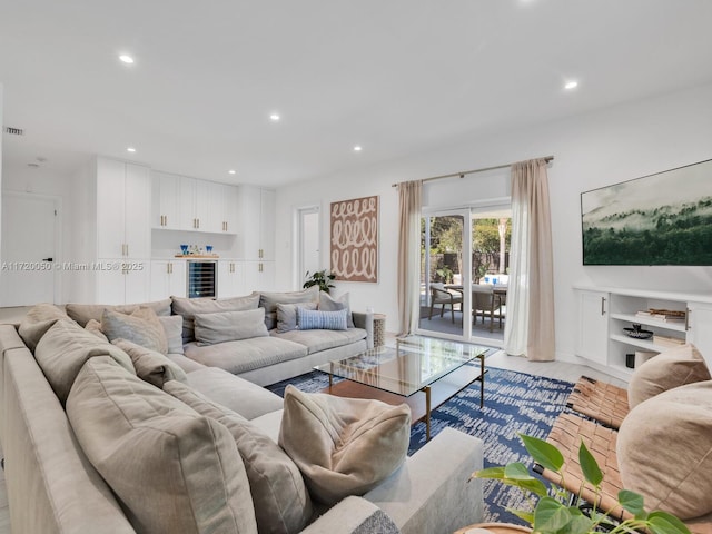 living area with beverage cooler, visible vents, and recessed lighting