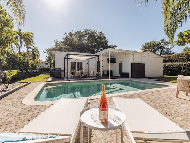 view of pool with a fenced in pool, a patio area, fence, and an outdoor hangout area