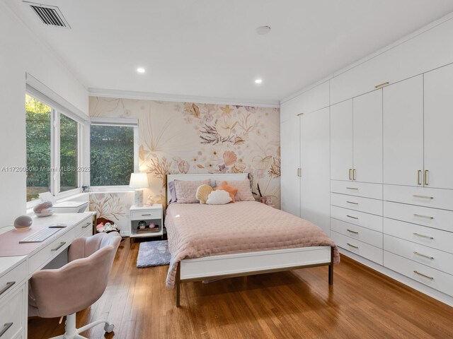 bedroom with recessed lighting, wallpapered walls, light wood-type flooring, and ornamental molding