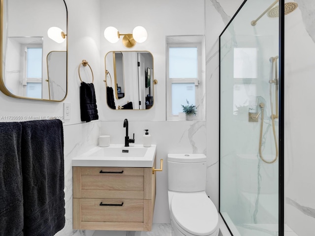 bathroom with a marble finish shower, toilet, and vanity