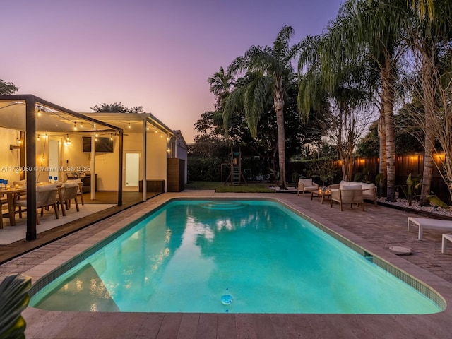 view of pool with a fenced in pool, a fenced backyard, and a patio area