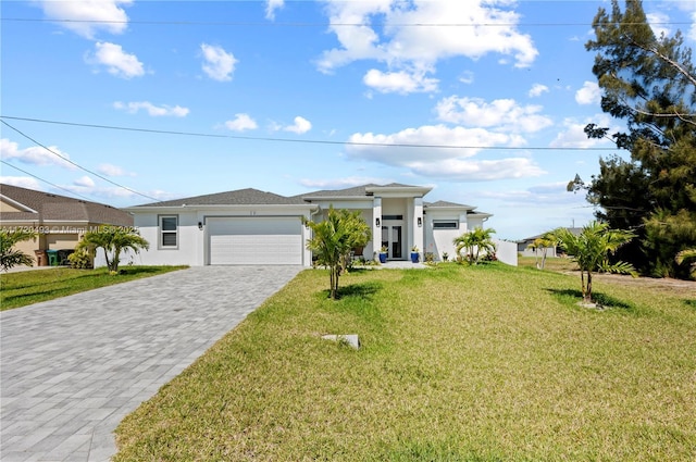 view of front of house with a garage and a front yard