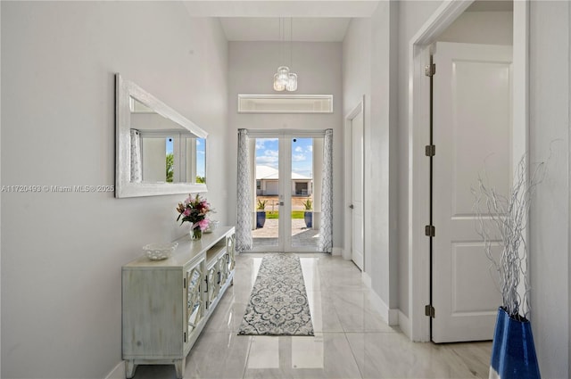 entrance foyer with a chandelier