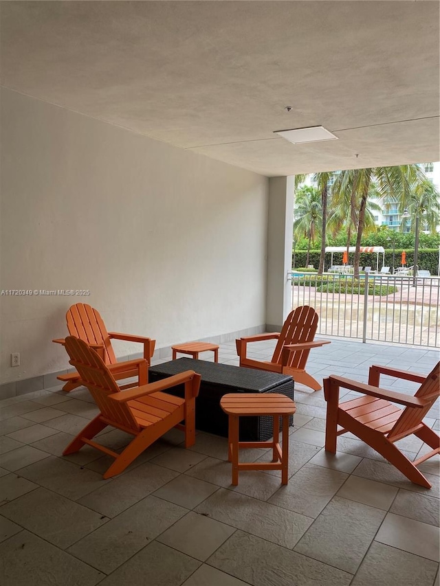 living area with floor to ceiling windows