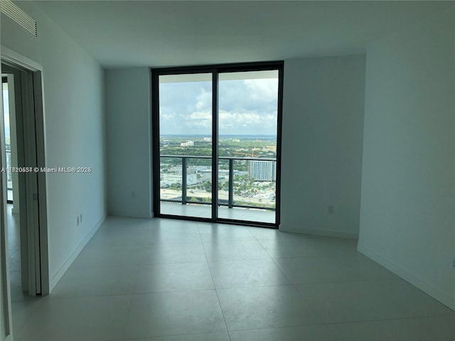 spare room with expansive windows