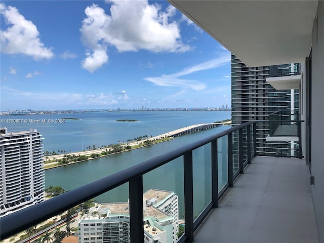 balcony featuring a water view