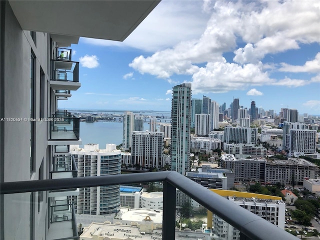 balcony featuring a water view