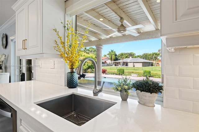 kitchen with beam ceiling, sink, wooden ceiling, decorative backsplash, and white cabinets