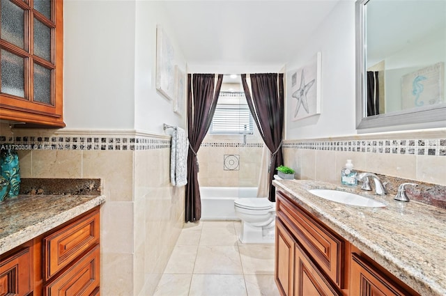 full bathroom with vanity, shower / tub combo, and toilet