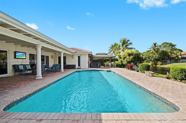 view of swimming pool with a patio area