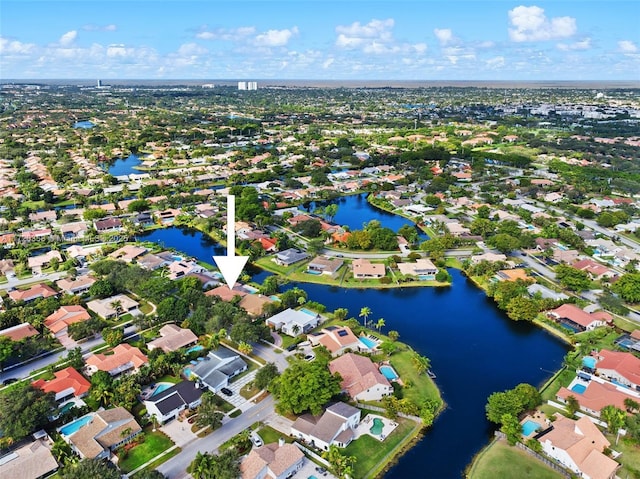 bird's eye view with a water view