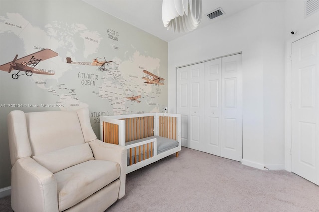 unfurnished bedroom featuring carpet and a closet