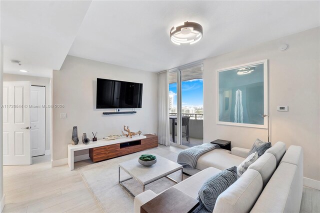 living room with light hardwood / wood-style floors